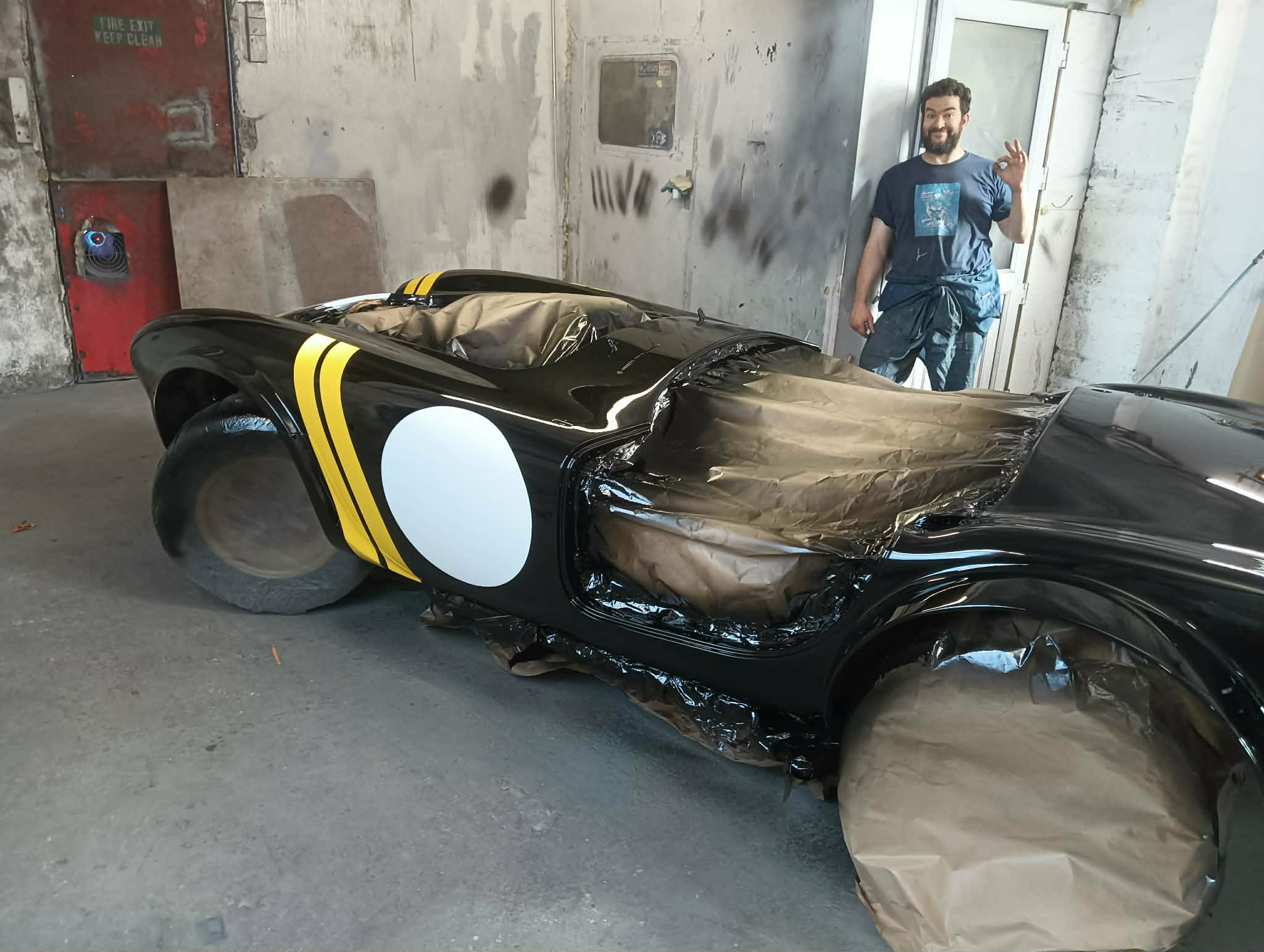Workshop handover of a completed Classic Cobra restoration paint job