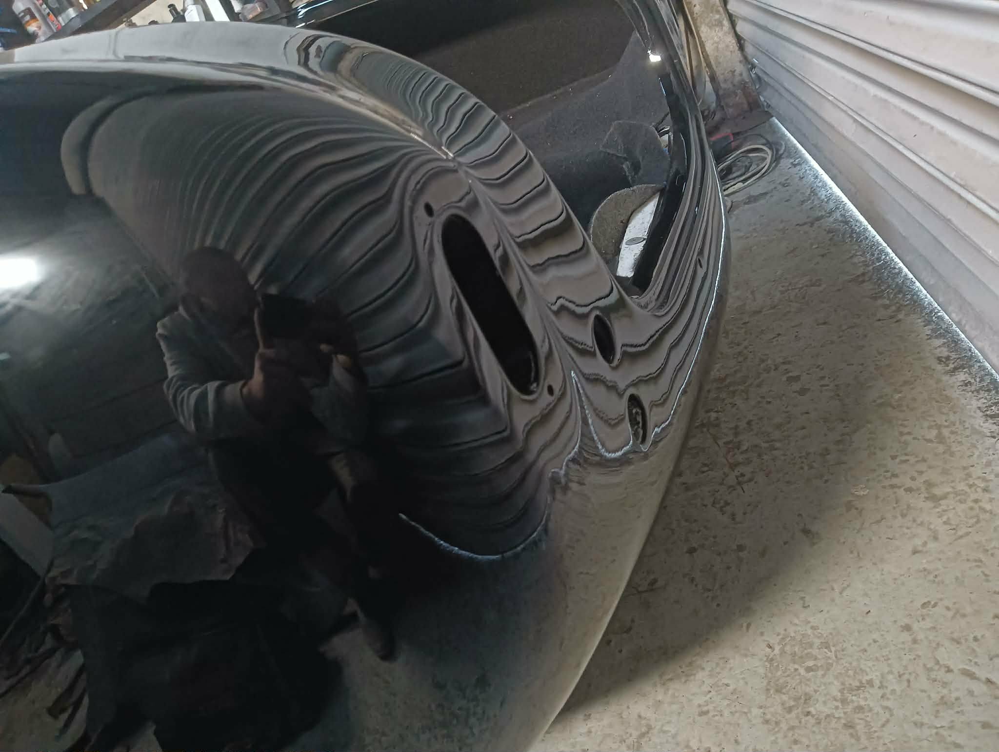 Reflection detail on black Classic Cobra paintwork after final finishing