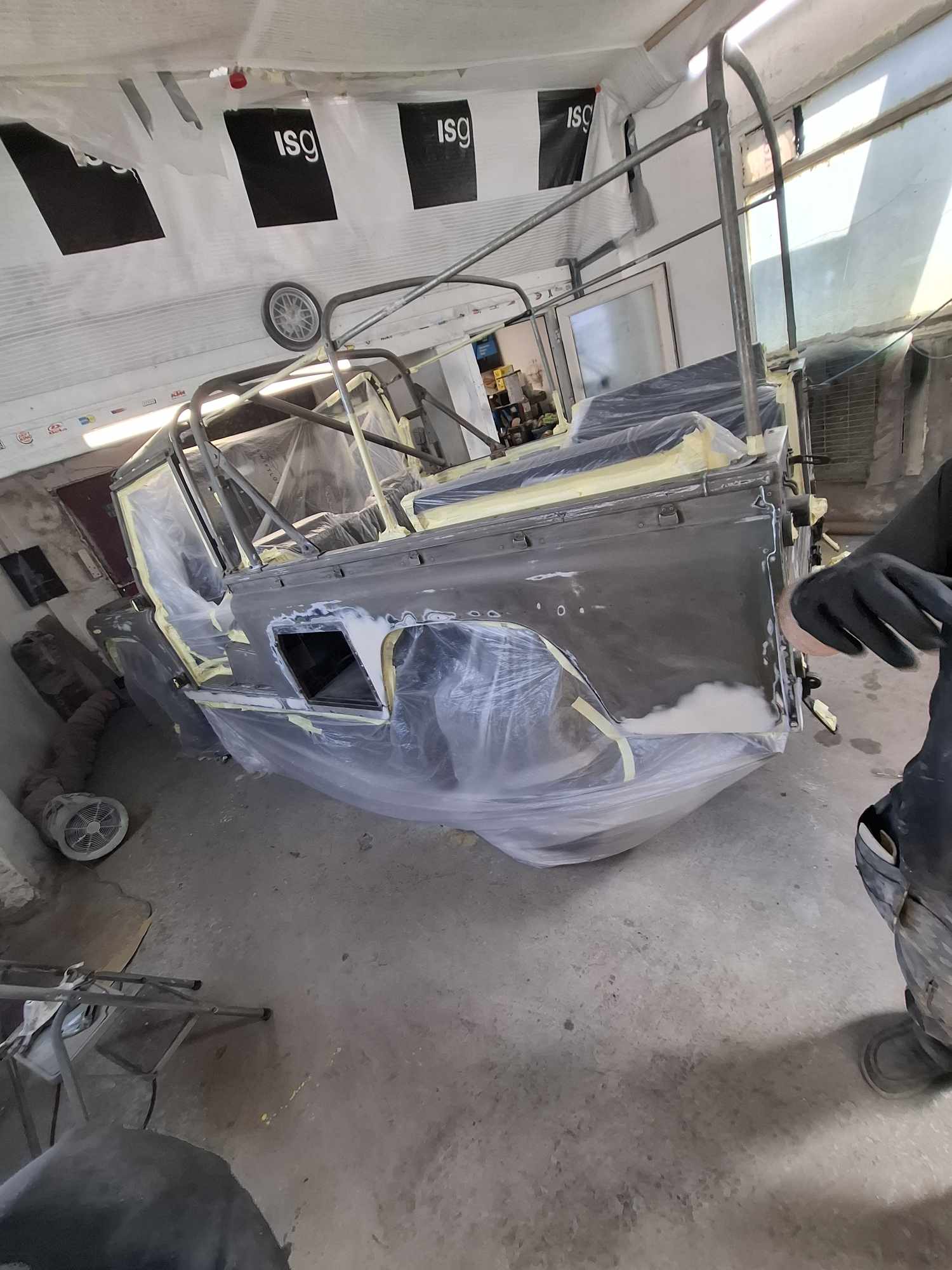 Land Rover bodywork masked and prepared before Raptor coating application