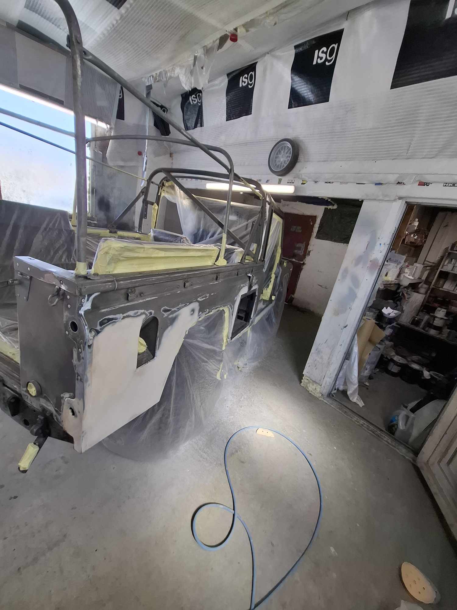 Land Rover rear body panel prepared for rust treatment and Raptor application