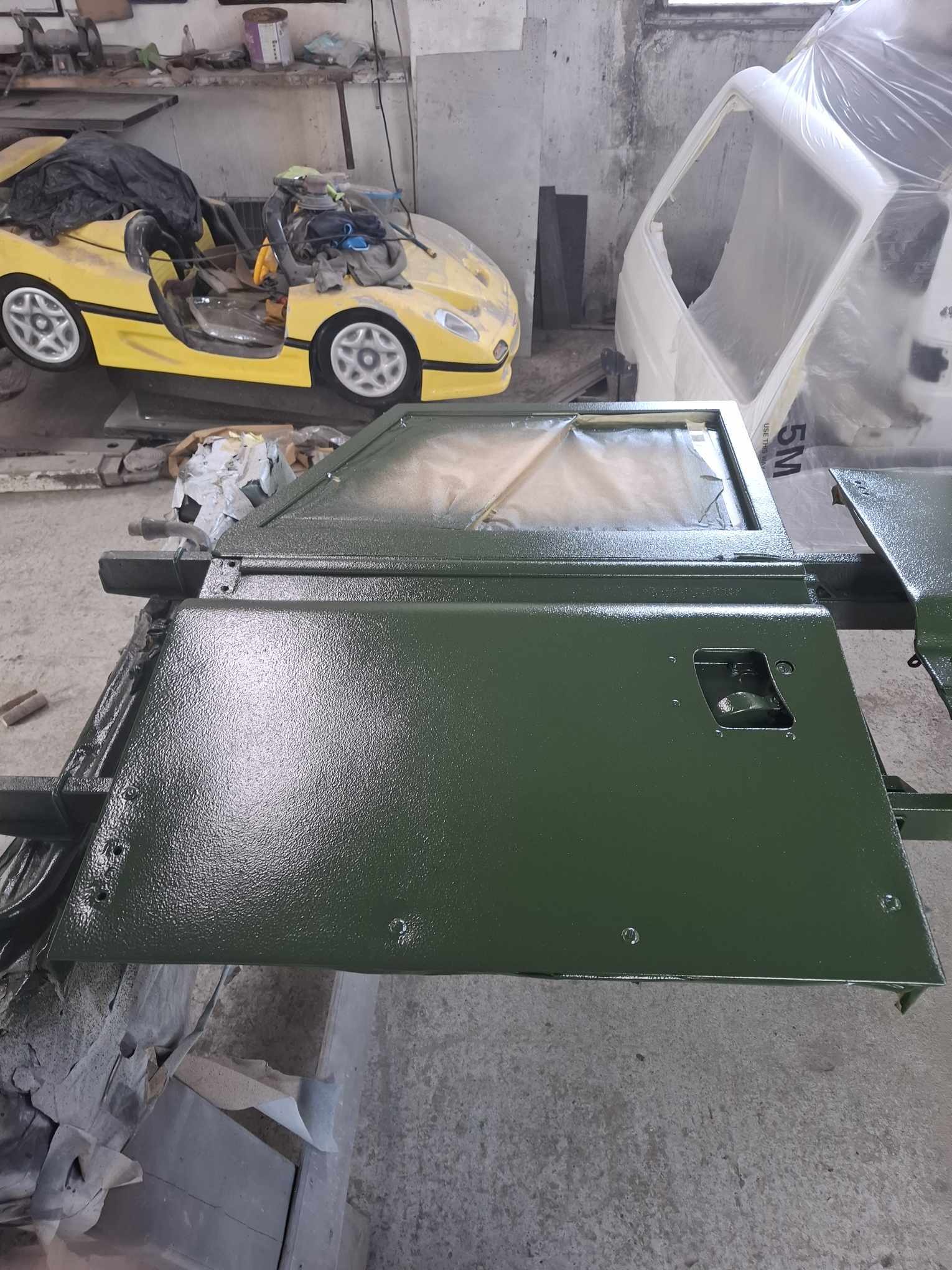 Land Rover door and panel after green Raptor coating and refitting