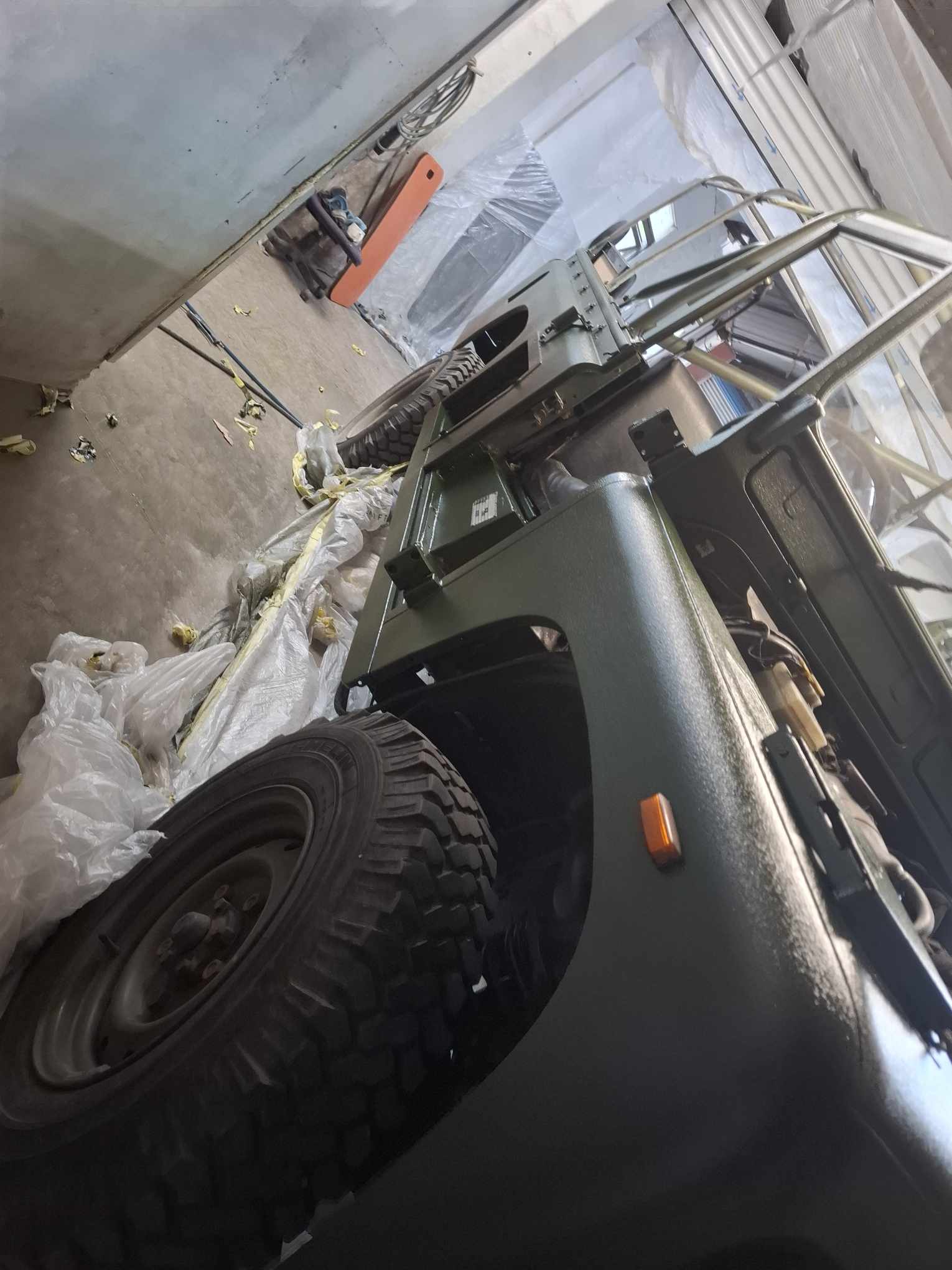 Land Rover side painted in practical green Raptor finish